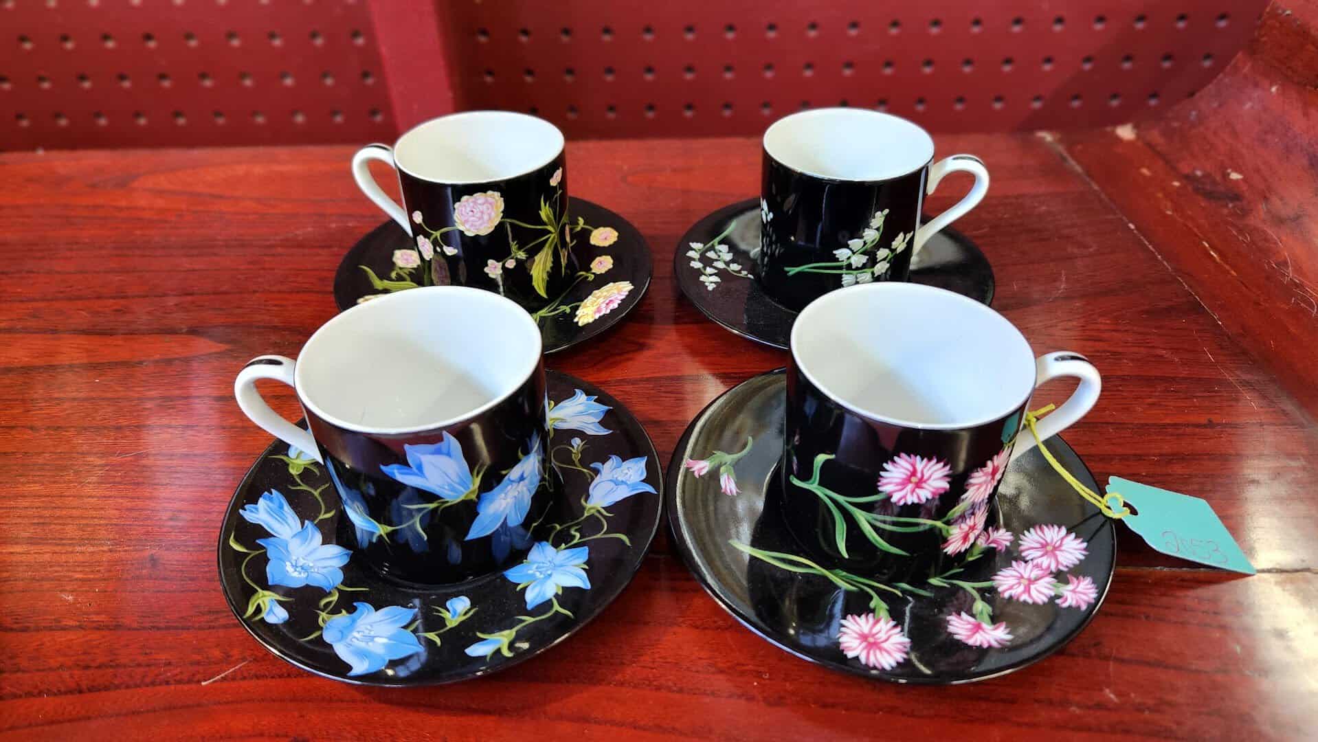Set of black floral vintage teacups and saucers at a Fort Worth antique mall