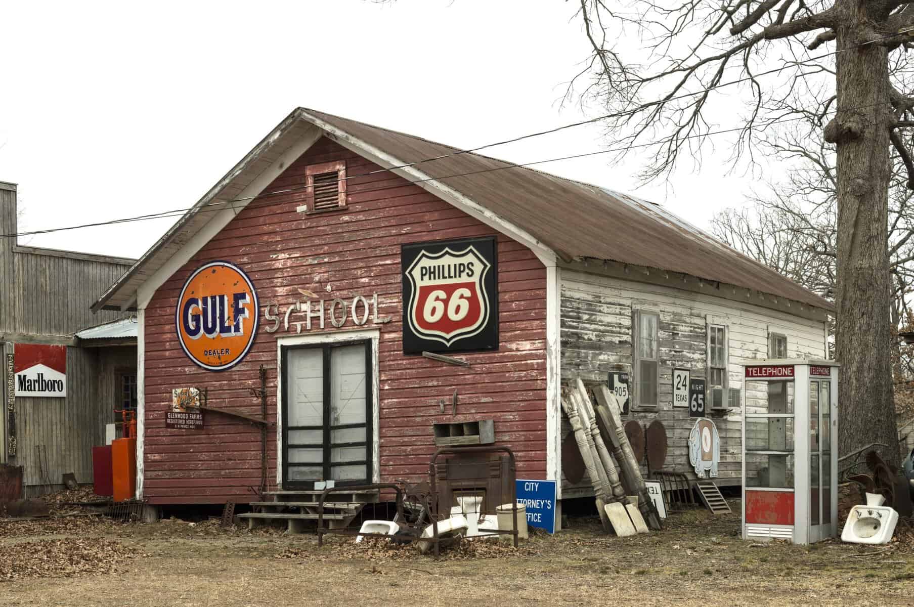 Vintage signs covering Blackburn's Antiques near Paris, Texas