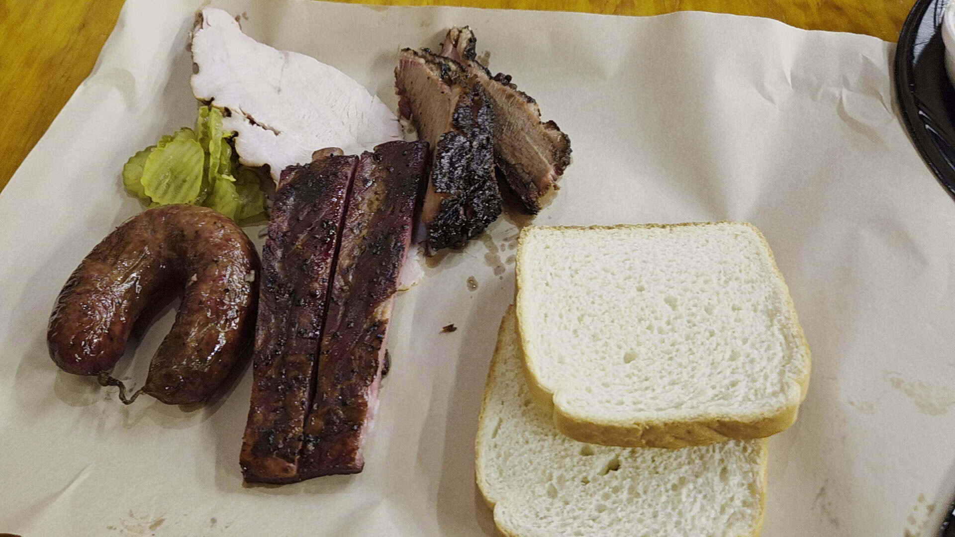 Sliced brisket and sausage on butcher paper at Black's Barbecue in Lockhart, Texas