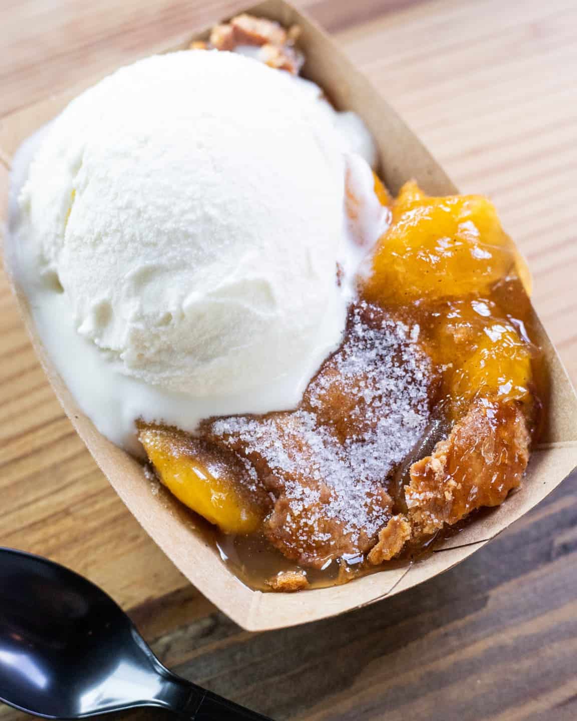 Warm peach cobbler with vanilla ice cream at Black's Barbecue in Lockhart, Texas