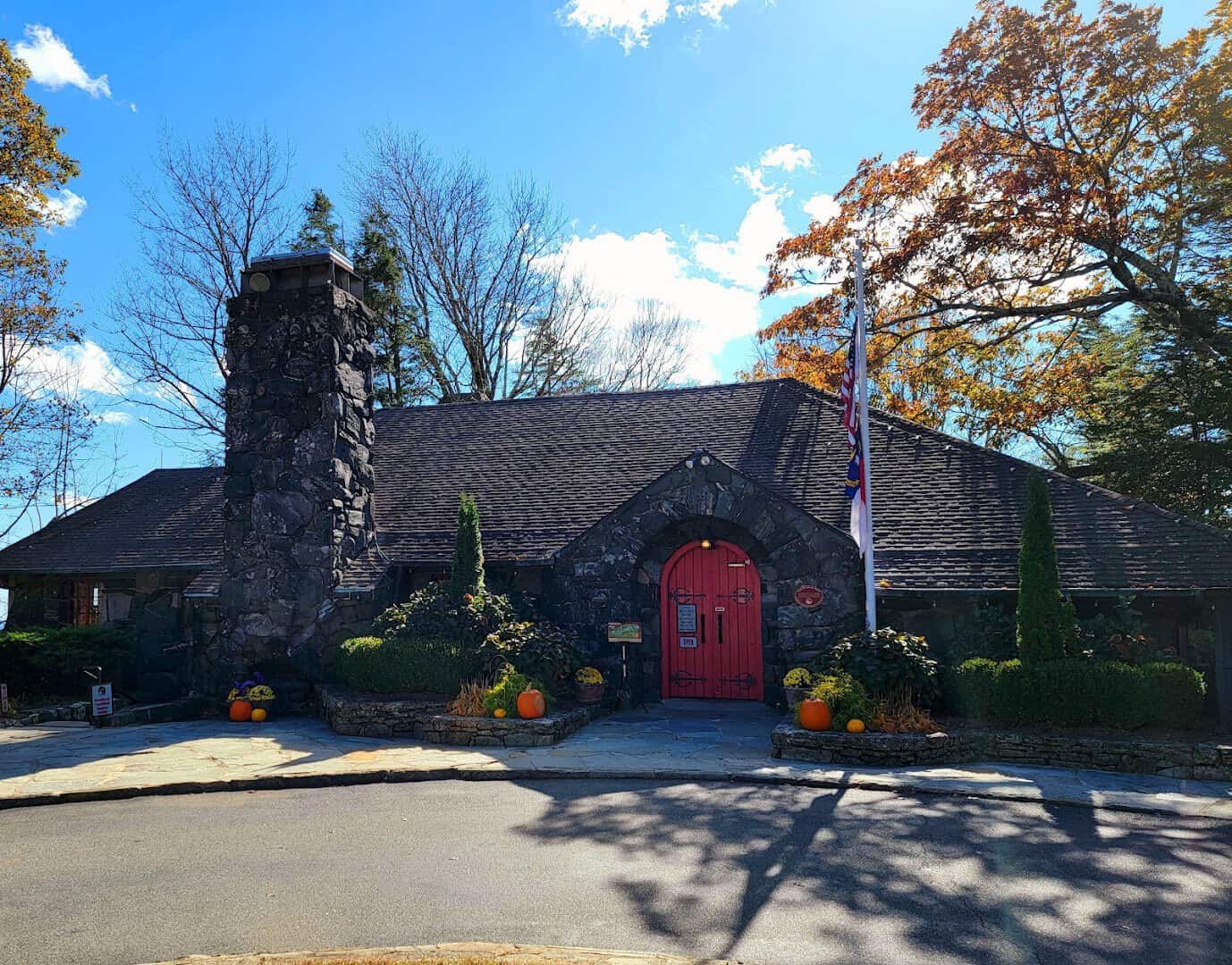 The Blowing Rock storefront decorated with pumpkins and fall foliage in Blowing Rock, North Carolina