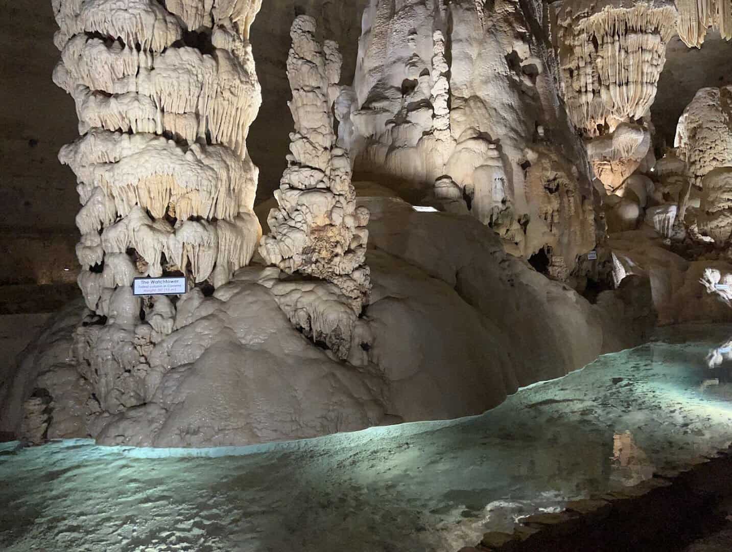 Still blue pool reflecting cave formations at Natural Bridge Caverns