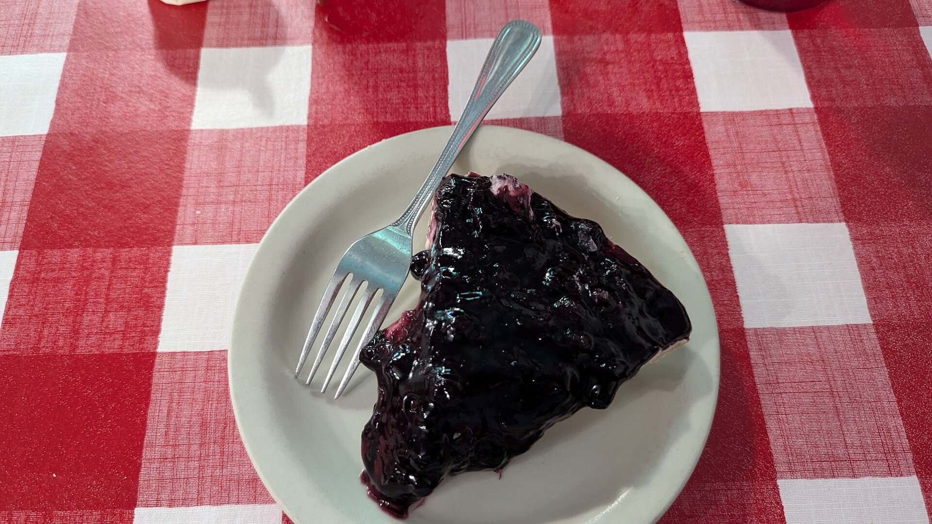 Slice of blueberry pie on a plate at Texan Cafe and Pie Shop in Hutto, Texas