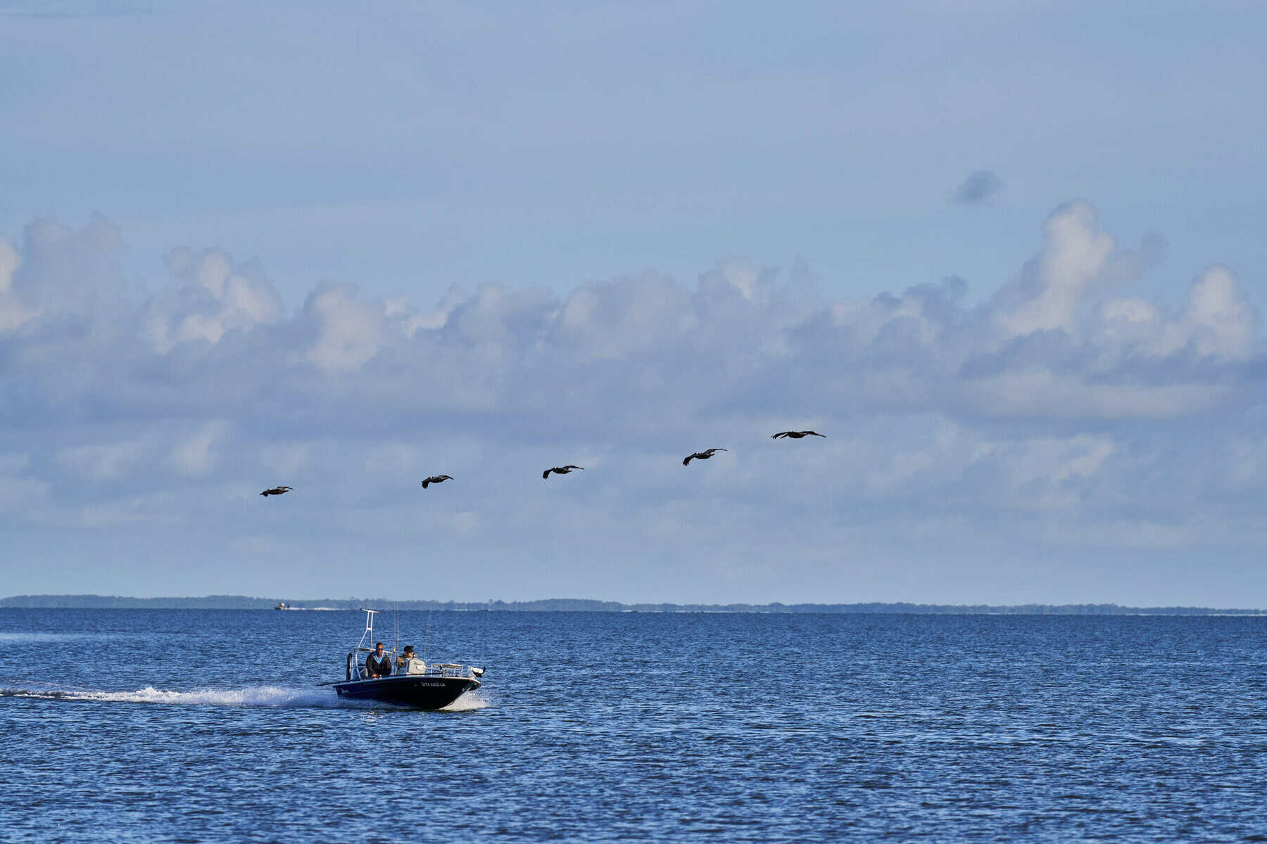 A boat crossing the bay near the Bolivar Peninsula, Texas