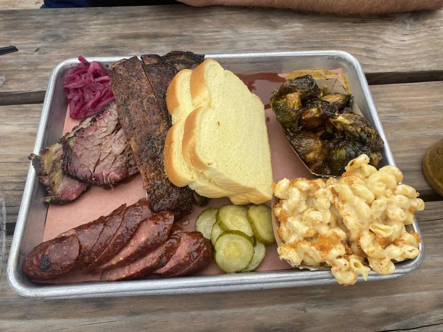 Brisket, sausage, bread and mac and cheese tray at Truth Barbeque in Brenham, Texas