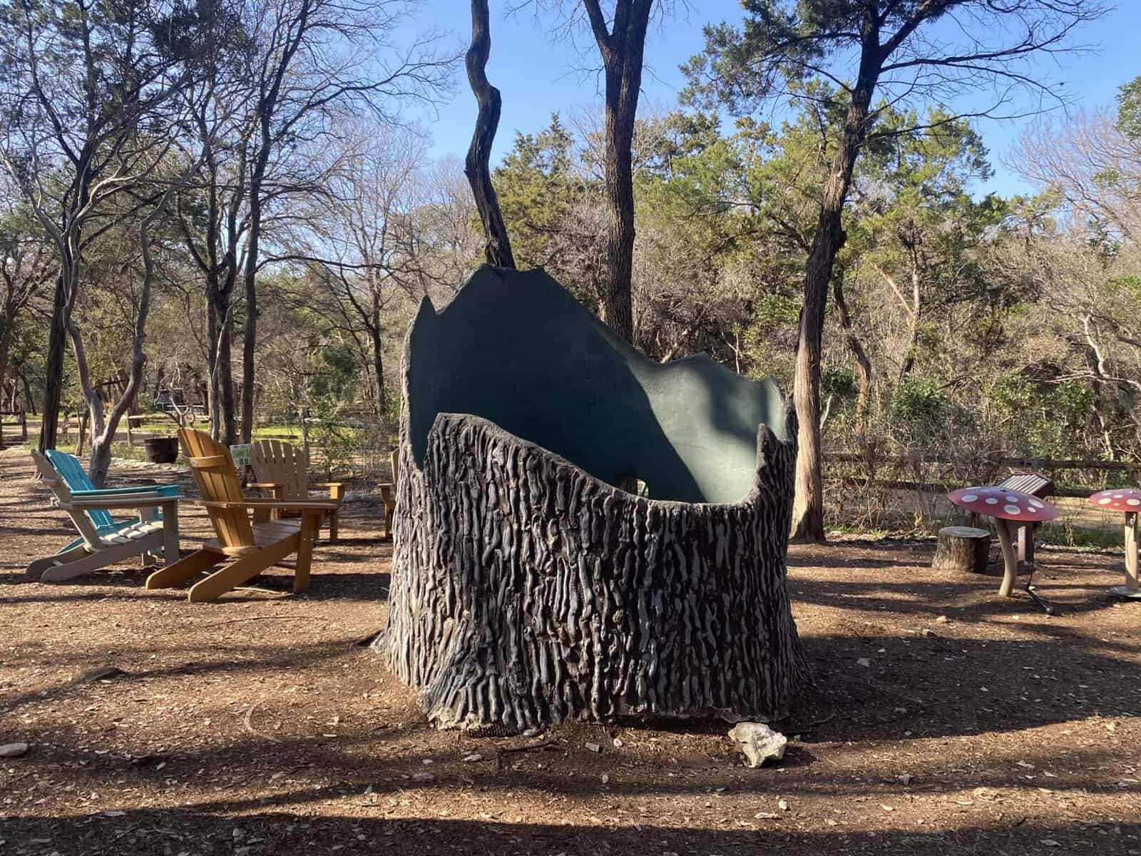 Life-size bronze Ornithomimus dinosaur sculpture in the Hartman Prehistoric Garden at Zilker Botanical Garden in Austin, Texas