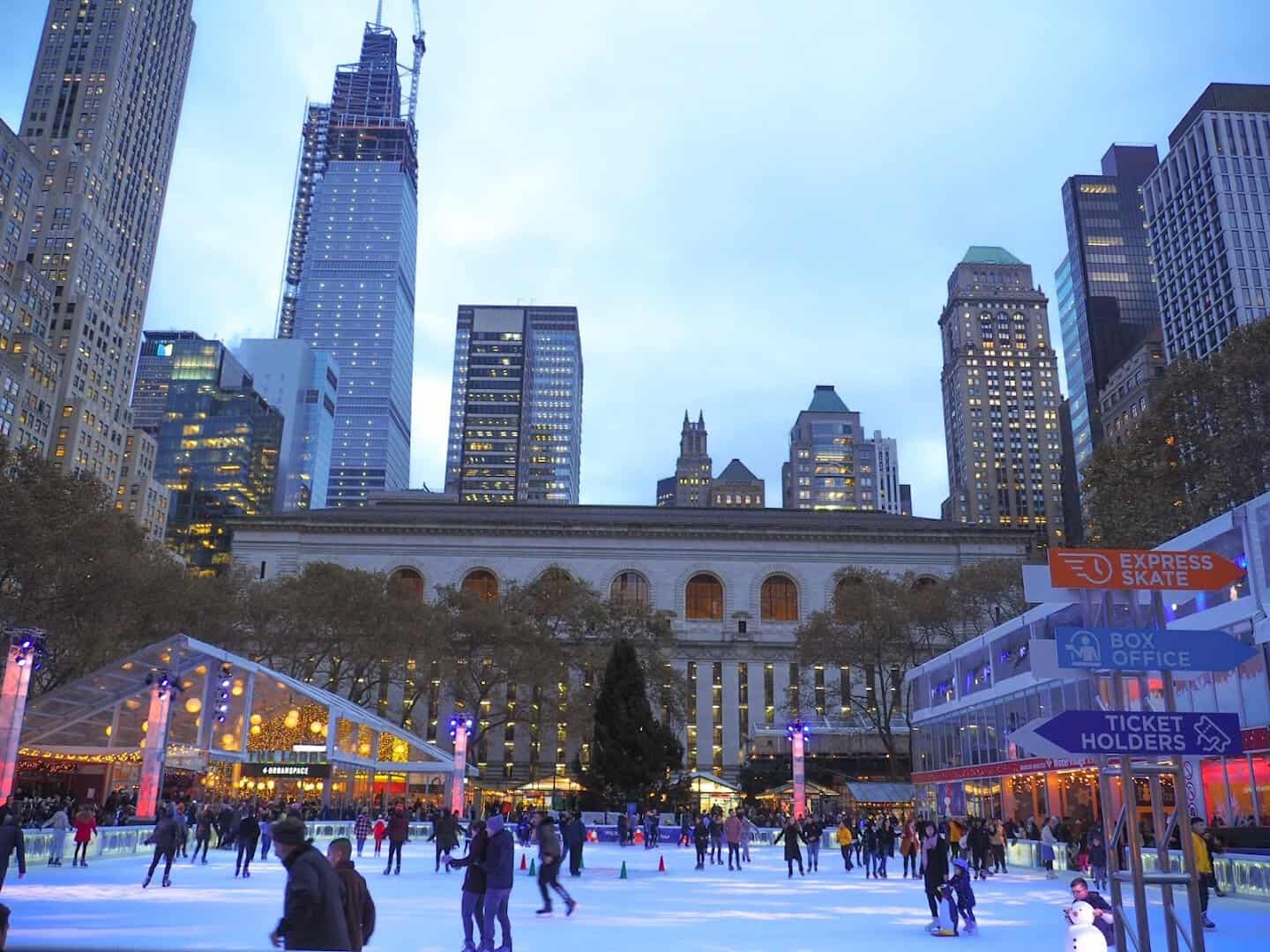 Lit Winter Village holiday shops and ice rink at Bryant Park in New York