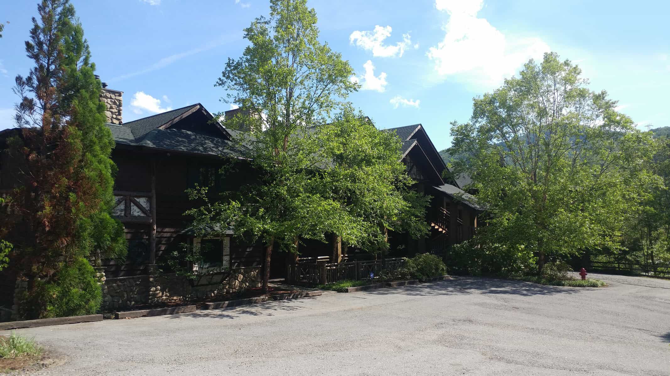 Adirondack-style lodge buildings in the woods at The Lodge at Buckberry Creek in Gatlinburg, Tennessee