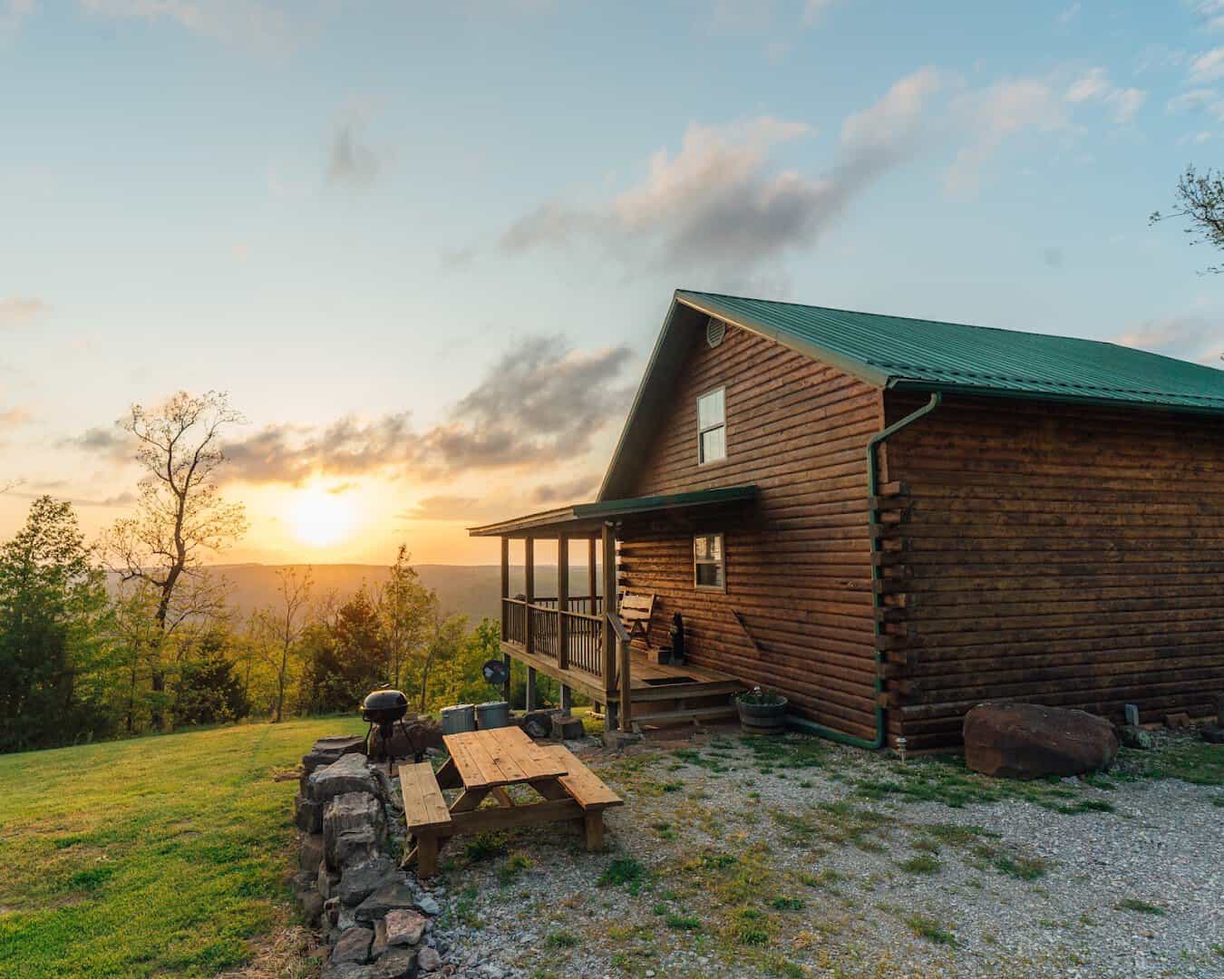Log cabin at golden hour at Buffalo Outdoor Center in Ponca, Arkansas