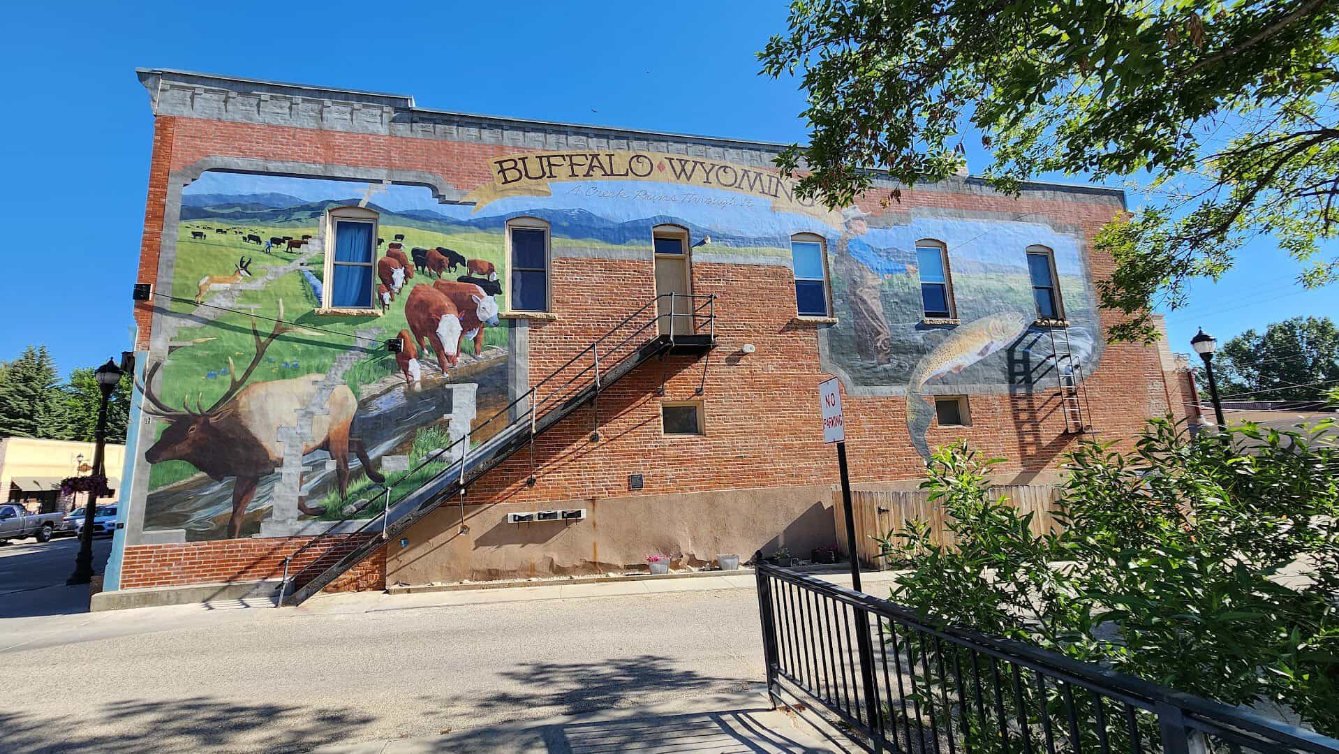Historic brick building with a Buffalo Wyoming mural on Main Street