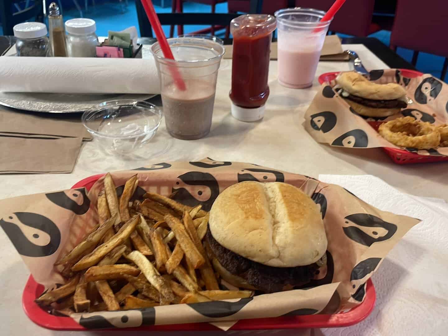 Burger and fresh-cut fries in a basket at Mel's Diner in Mingus, Texas