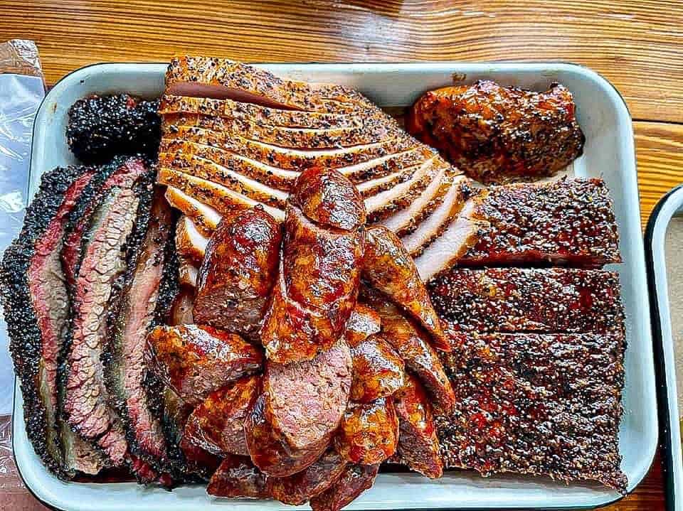 Tray of sliced brisket and ribs at Burnt Bean Co in Seguin, Texas