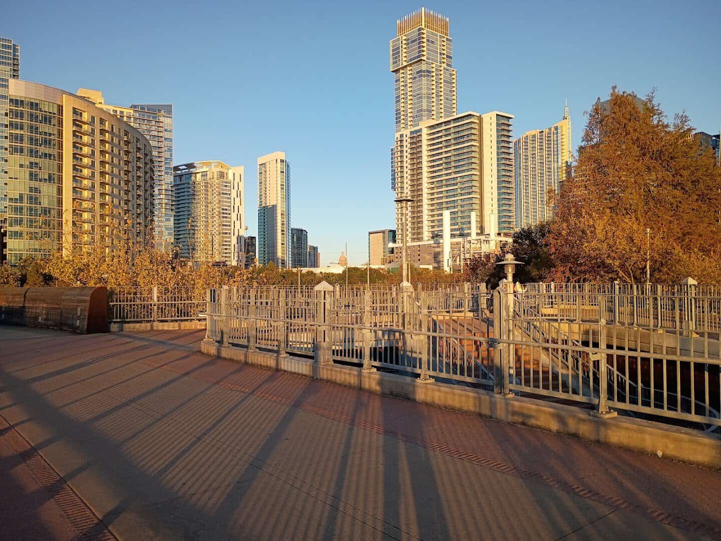 The Ann and Roy Butler Hike and Bike Trail boardwalk at golden hour in Austin