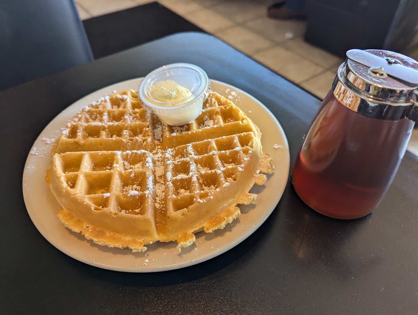 Golden buttermilk waffle with butter and syrup at Jonathon's Diner in Dallas
