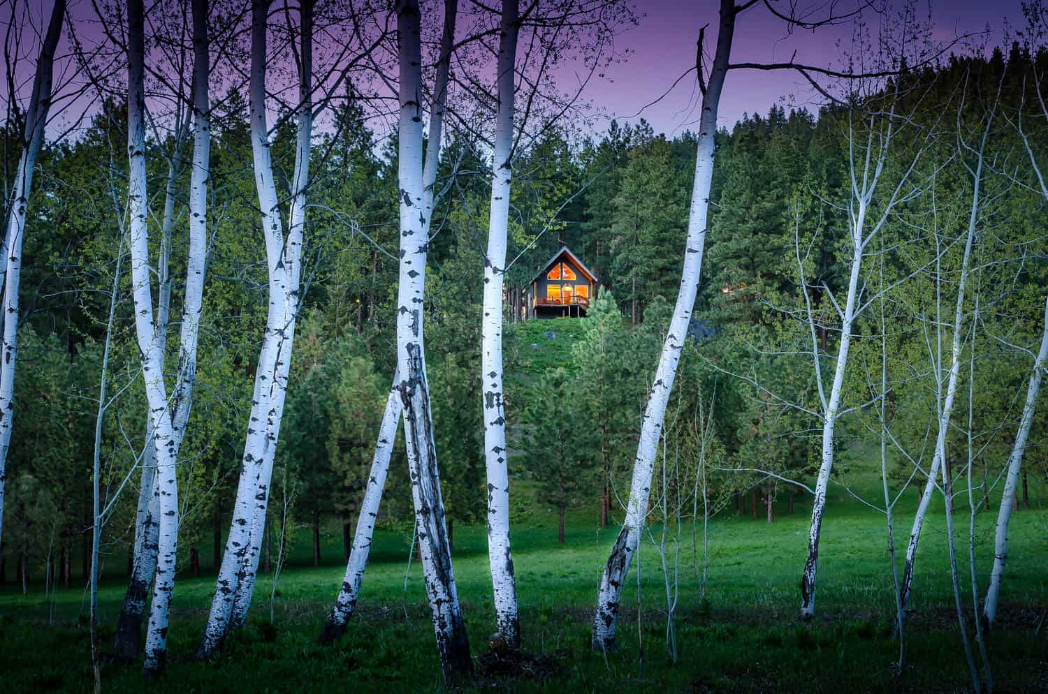 Cabin among the trees at twilight at Mountain Home Lodge near Leavenworth, Washington