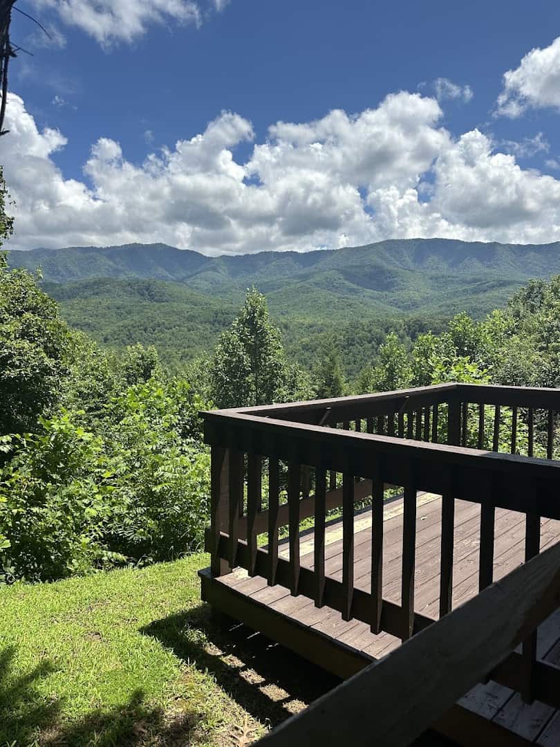 Cabin deck railing overlooking the Great Smoky Mountains at Elk Springs Resort in Gatlinburg, Tennessee