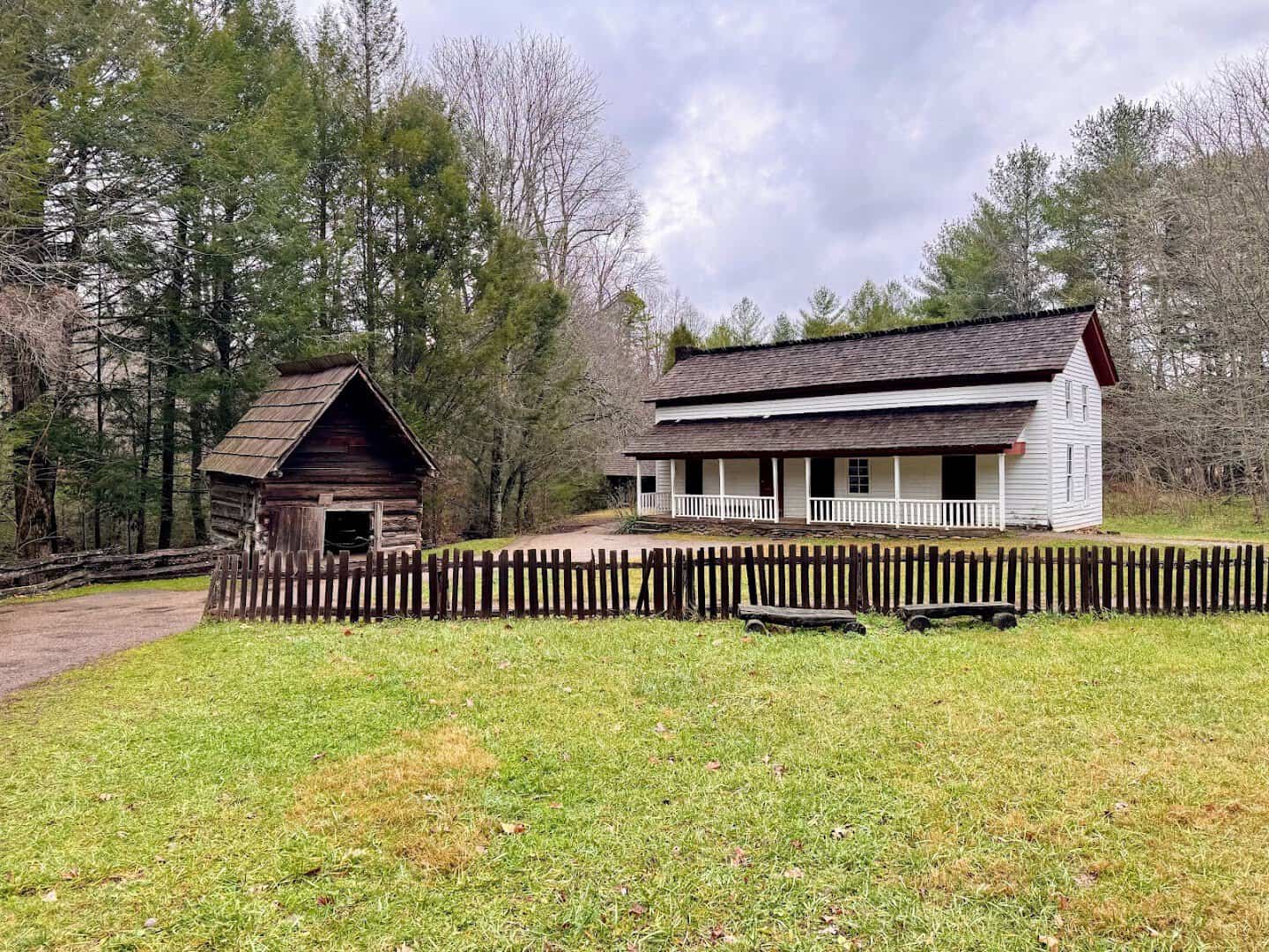 Historic homestead buildings and split rail fence in Cades Cove, Great Smoky Mountains, Tennessee