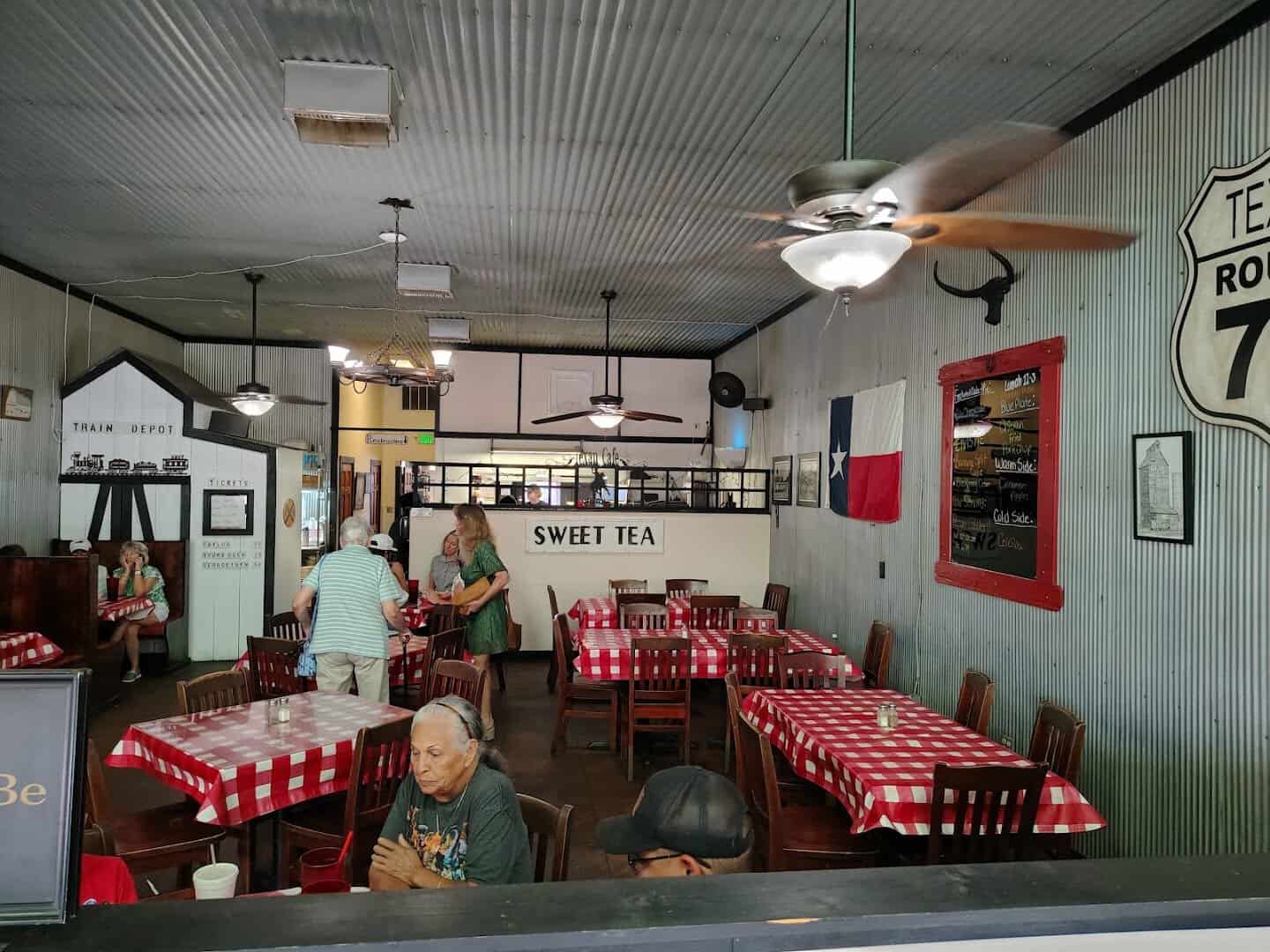 Country dining room with red checkered tablecloths at Texan Cafe and Pie Shop in Hutto, Texas
