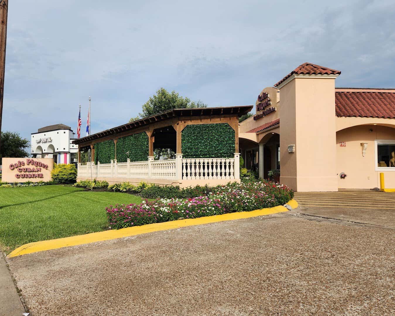 The Spanish mission-style exterior of Cafe Piquet in Bellaire, Texas