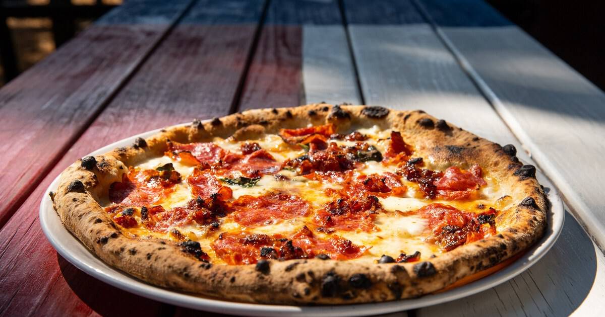 This Iconic Texas Pizzeria Bakes Blistered Wood-Fired Pies in Under 90 Seconds