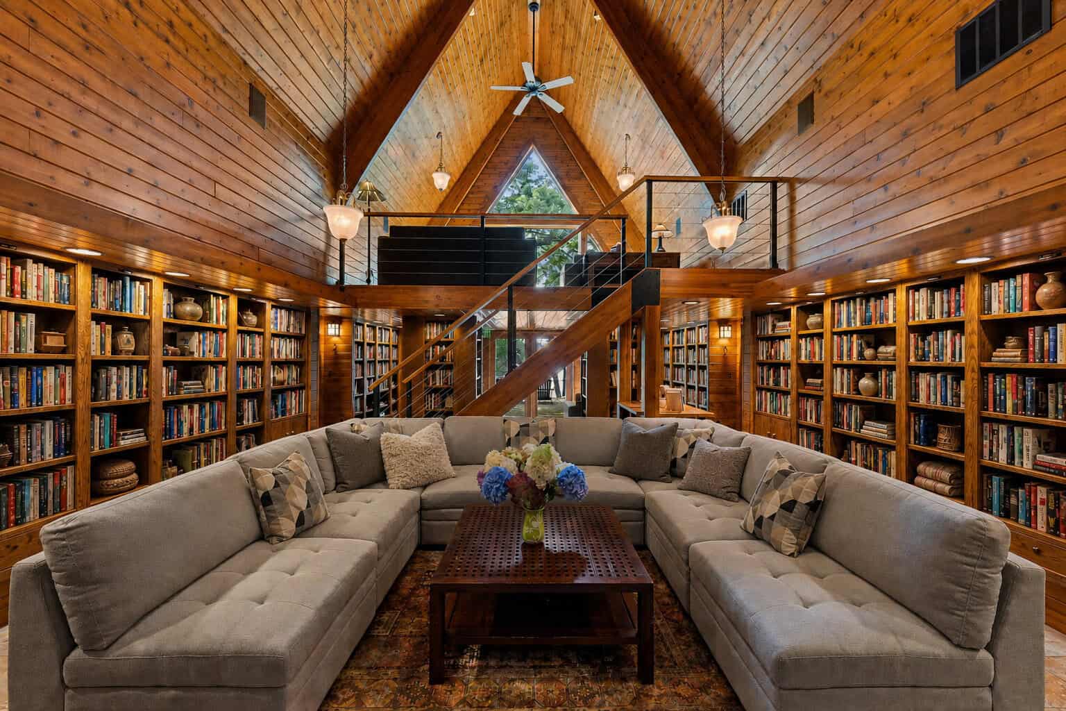Cozy library cabin interior with a vaulted wood ceiling at Canoe Bay in Wisconsin