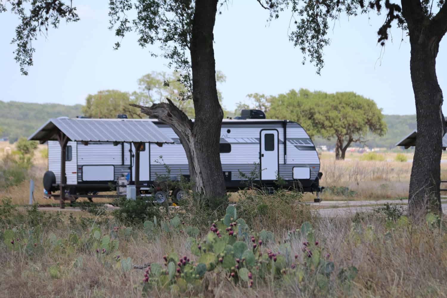 Lakeside campsite among the trees at Canyon Lake, Texas
