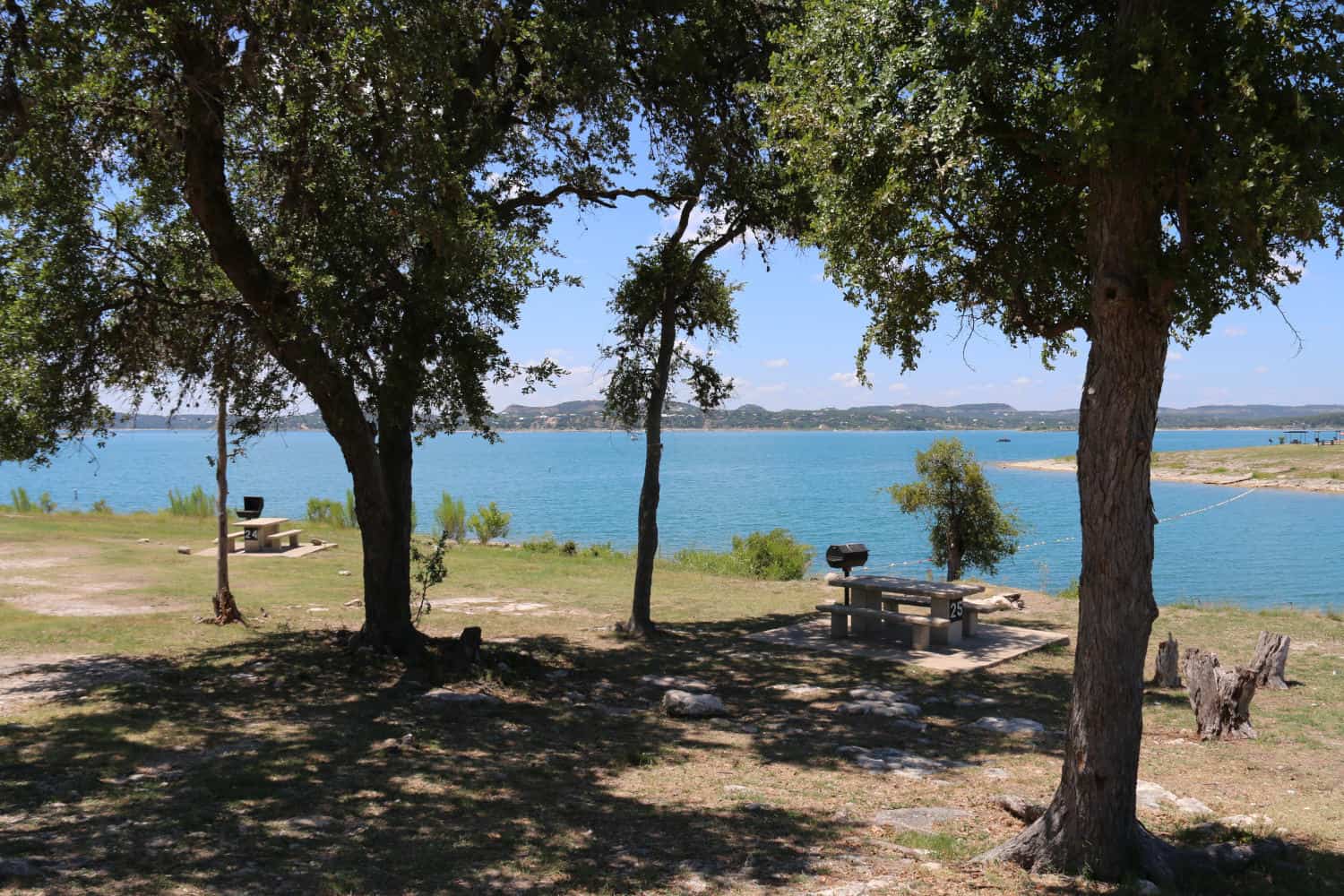 Turquoise cove and tree-lined shoreline at Canyon Lake, Texas