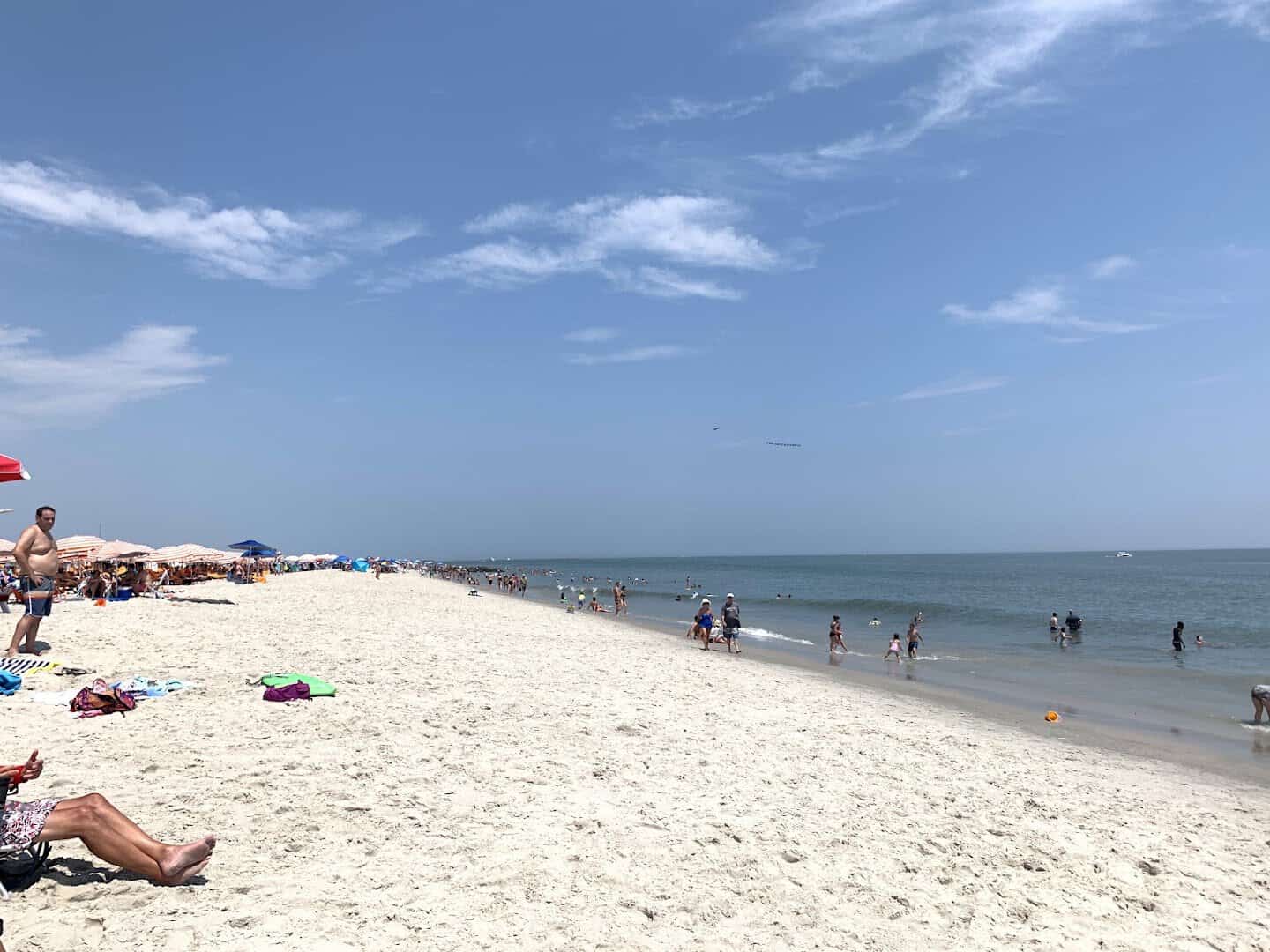 The wide sandy beach under blue skies at Cape May, New Jersey