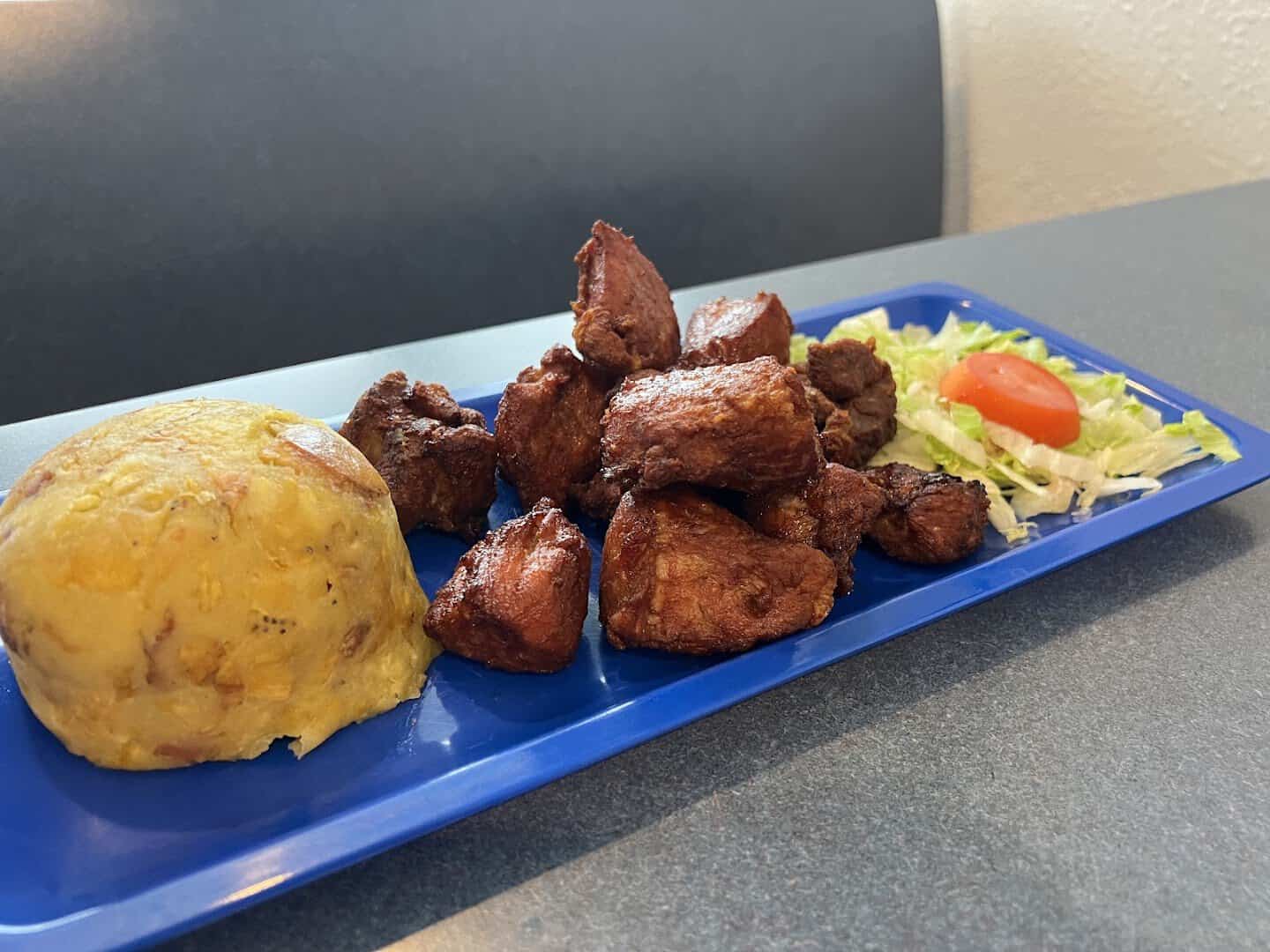 Carne frita fried pork cubes with mofongo at Tex-Chick in Houston