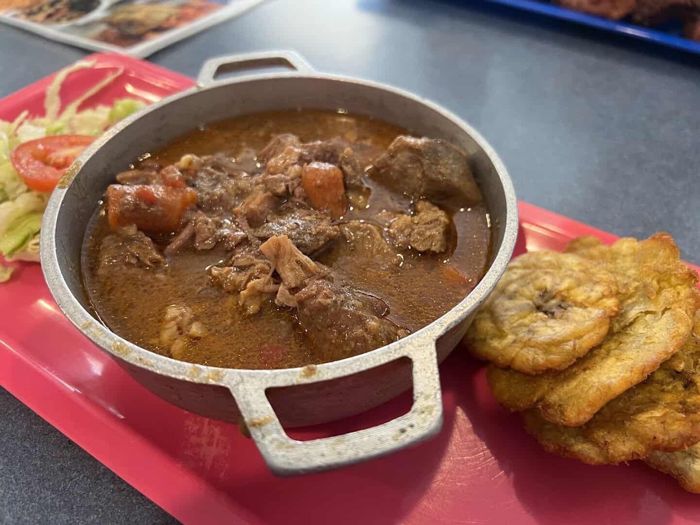 Puerto Rican stewed meat with tostones at Tex-Chick in Houston