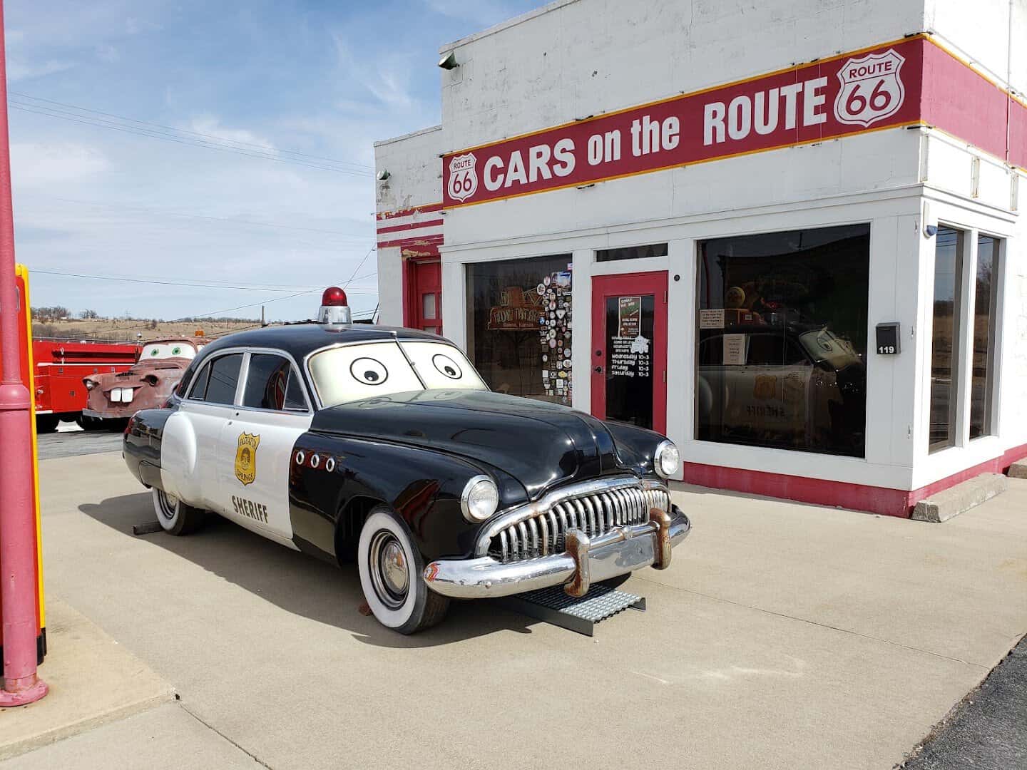 Cars on the Route storefront with a vintage Sheriff car in Galena, Kansas