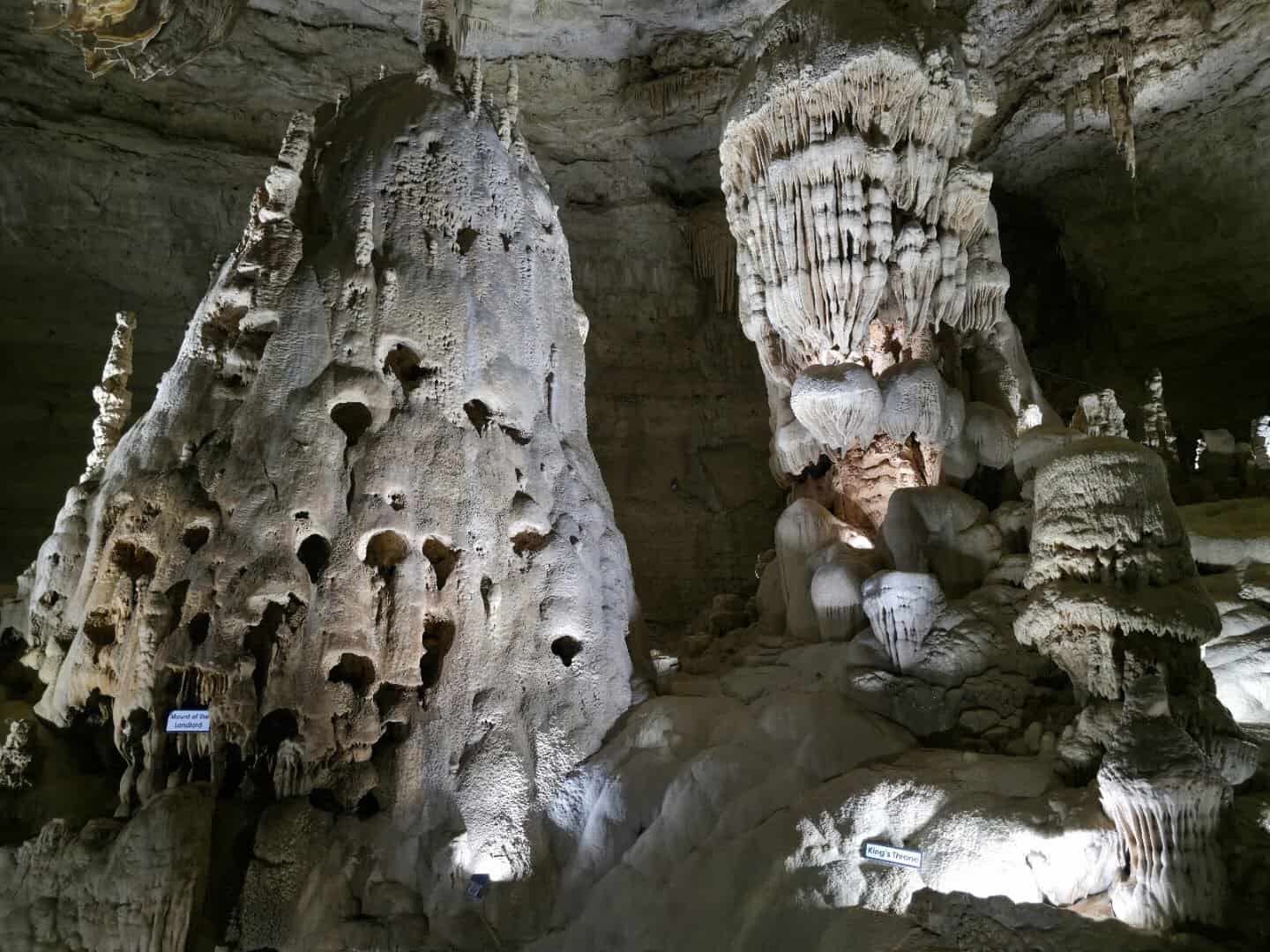 Towering pale limestone formations in Natural Bridge Caverns