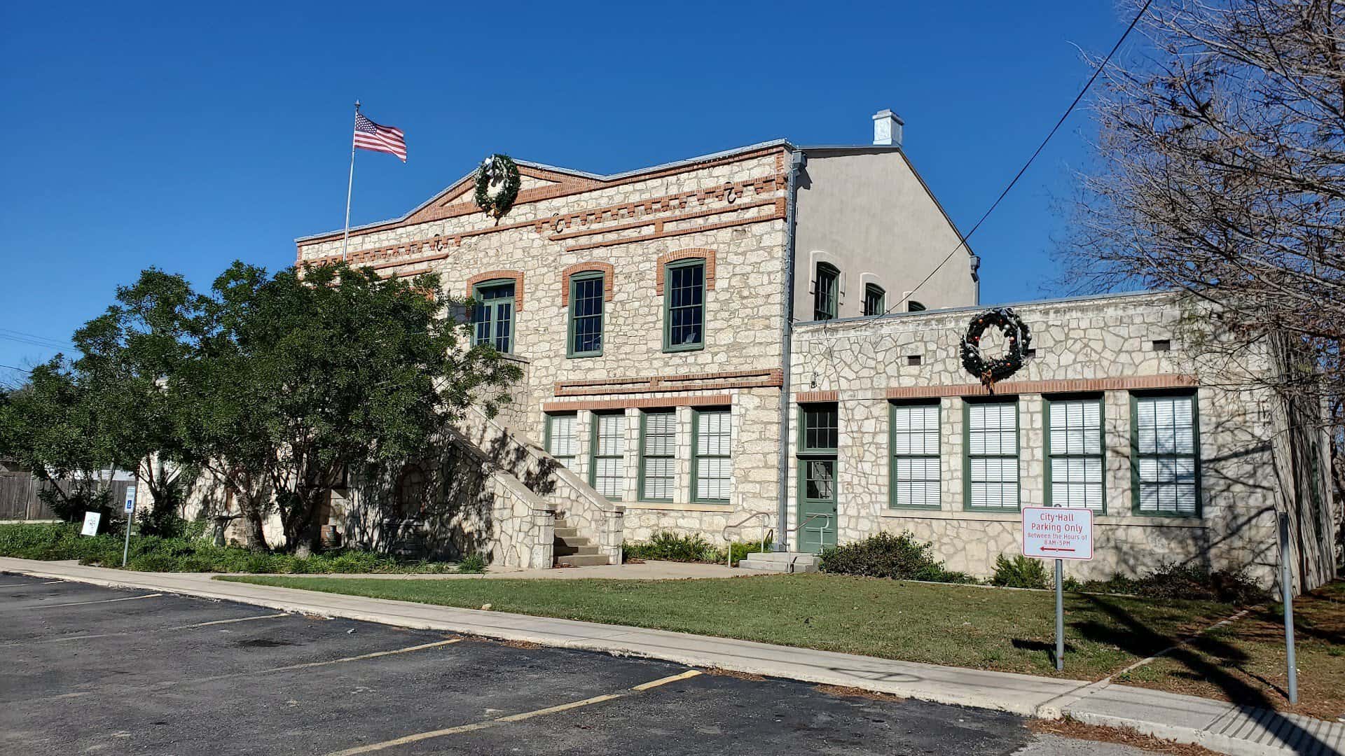 Historic limestone City Hall building in Castroville, Texas