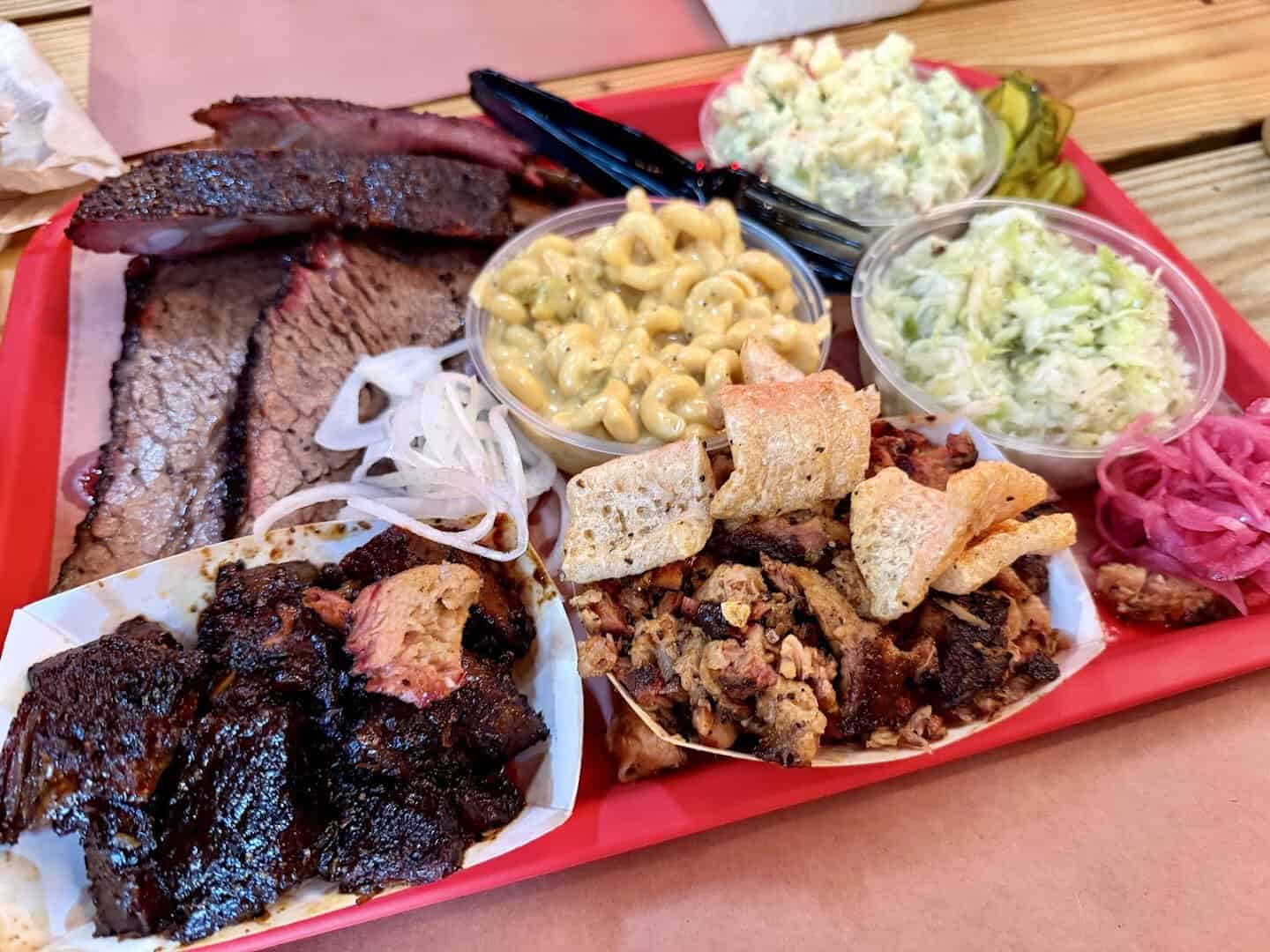 Tray of brisket, burnt ends and ribs with mac and cheese at Cattleack Barbeque in Dallas, Texas