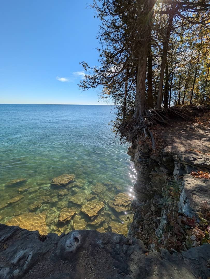Autumn leaves and clear water at Cave Point County Park, Door County, Wisconsin in fall