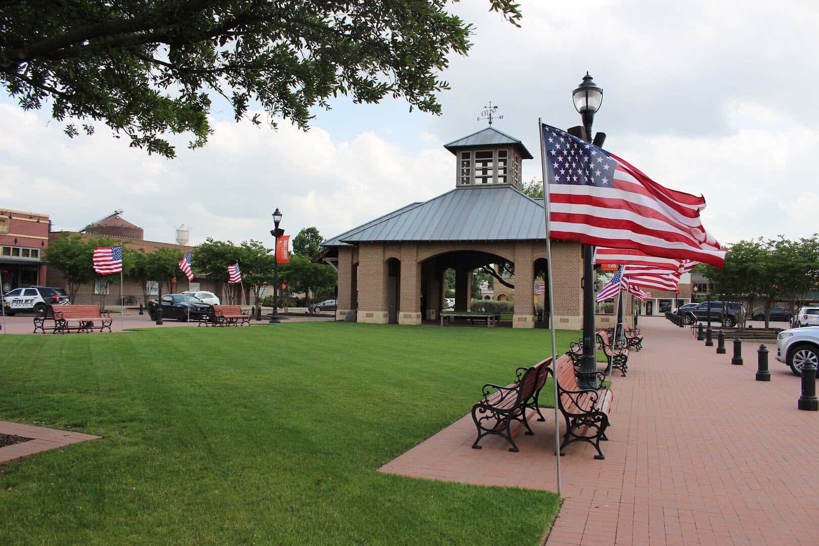 American flags line the green town square in downtown Celina, Texas