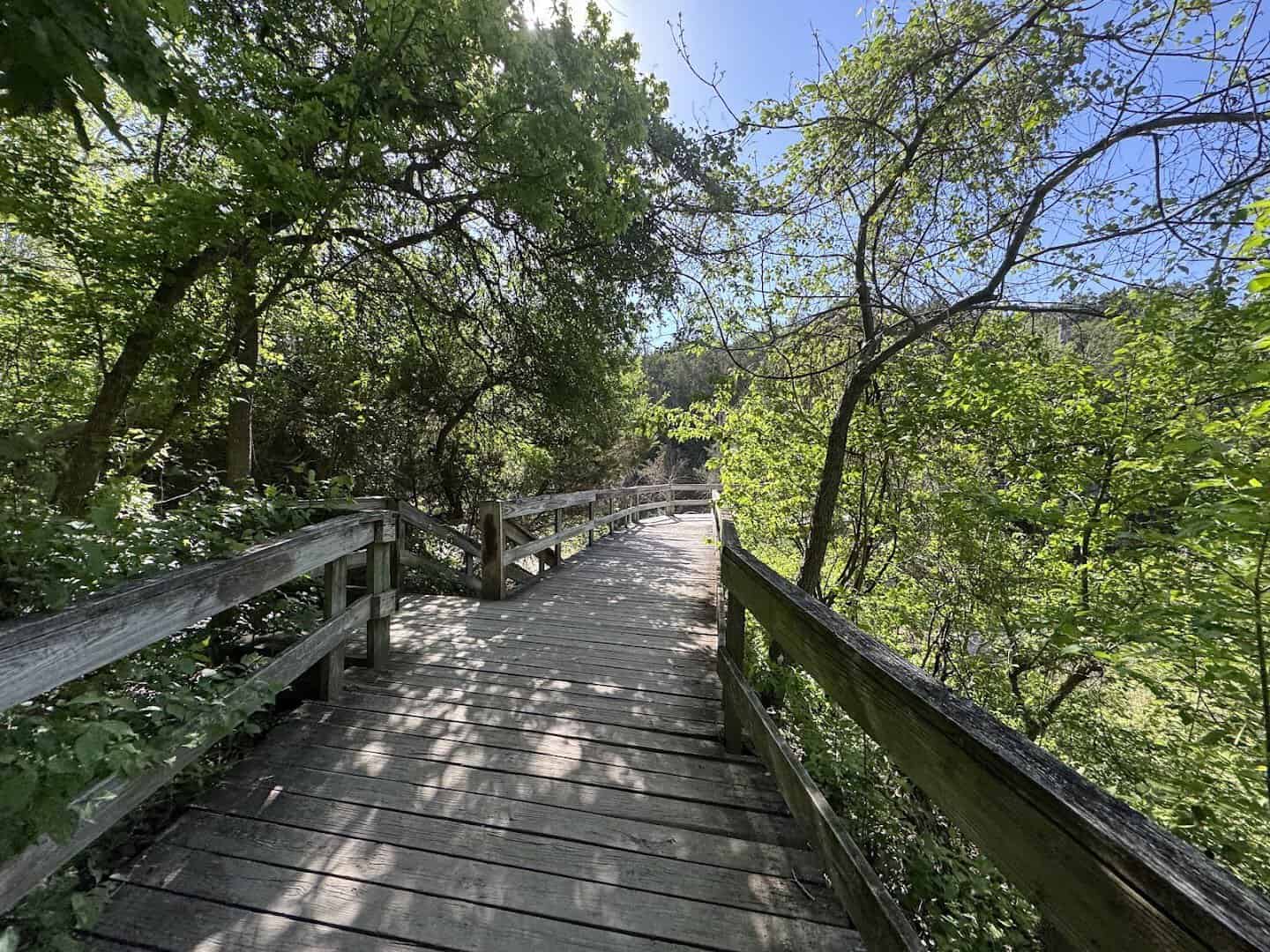 Wooden boardwalk along the trail at Chalk Ridge Falls Park in Belton, Texas
