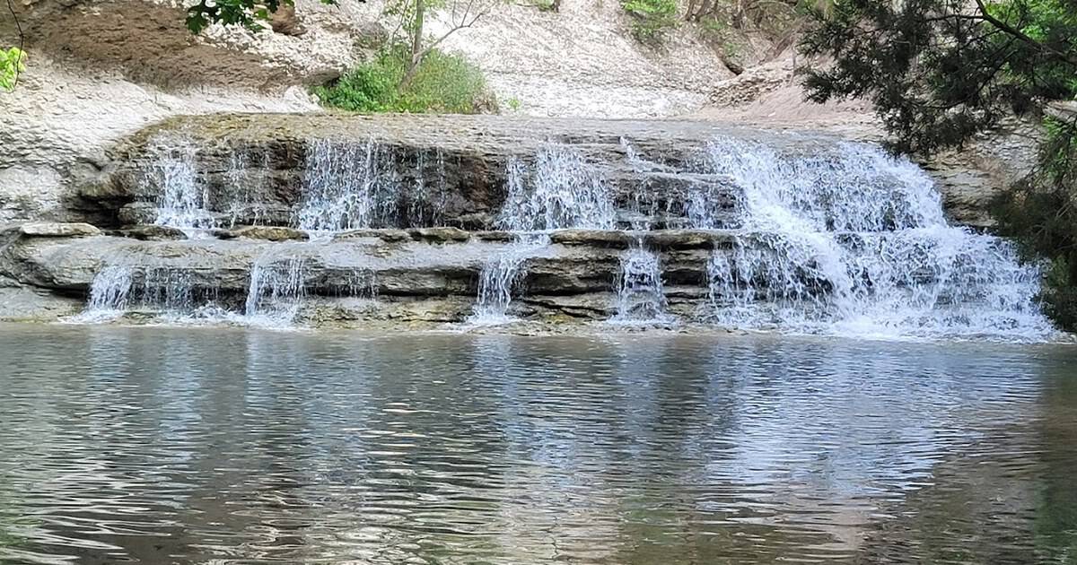 This Short Texas Trail Hides a Waterfall and Cold, Clear Swimming Holes Just Below a Dam