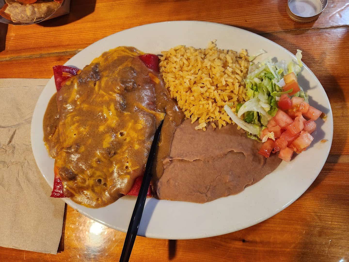 Cheese enchiladas in chili gravy with rice and beans at Ray's Drive Inn in San Antonio