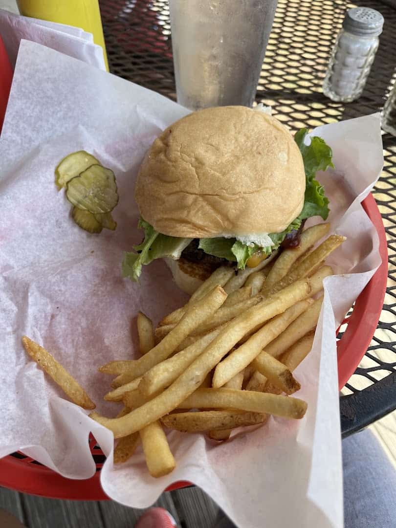 Cheeseburger with mounds of fries at Roadhouse in Bastrop, Texas