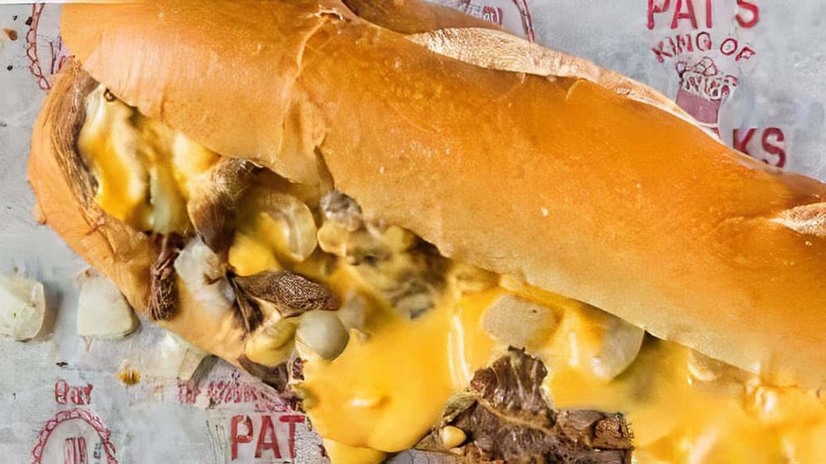Philly cheesesteak with melted cheese at Pats King of Steaks