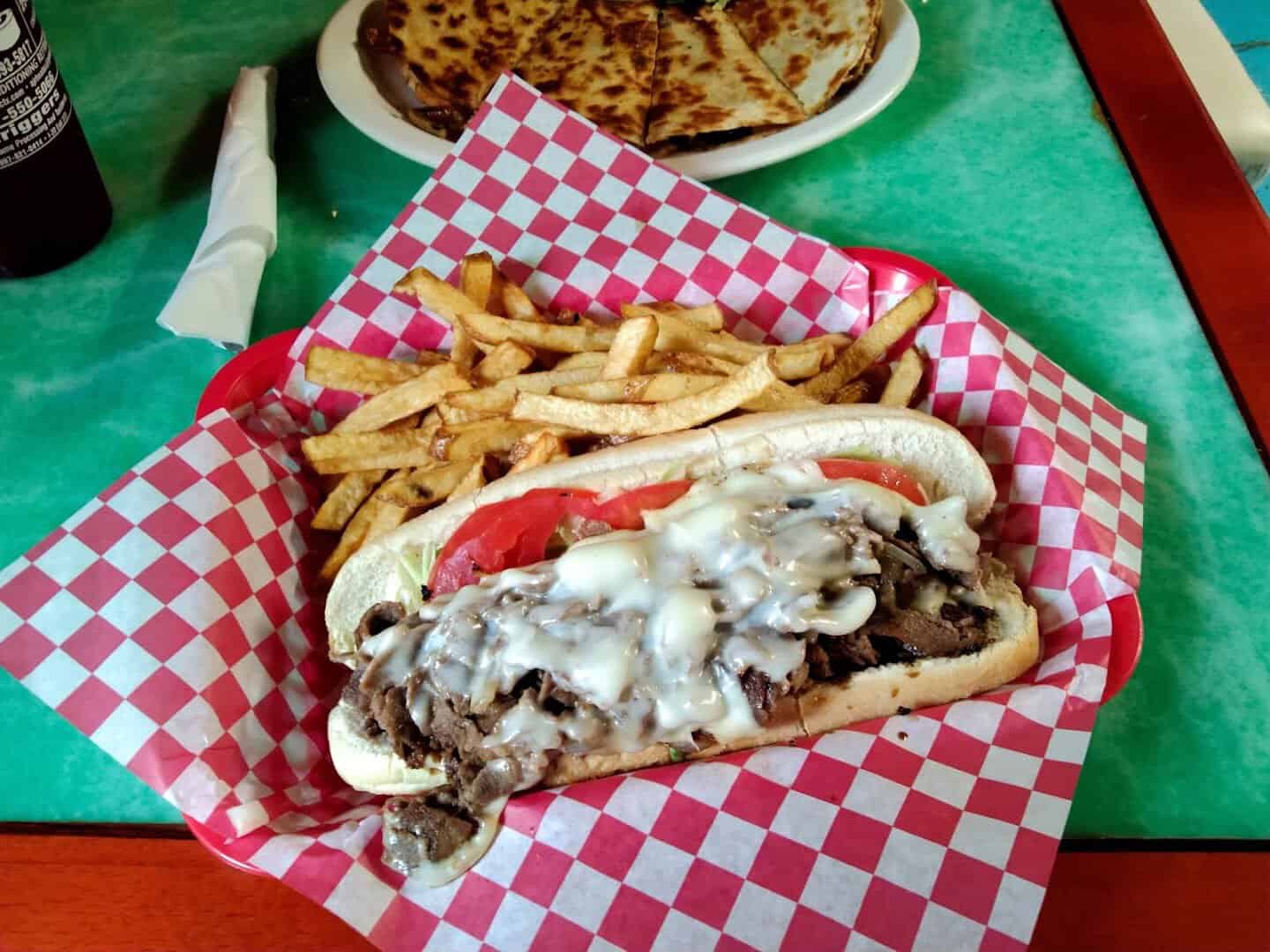 Cheesesteak, fries and quesadilla plate at Mel's Diner in Mingus, Texas