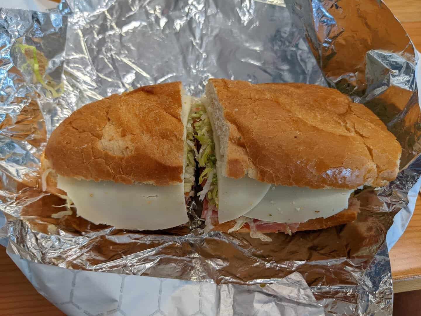 Cheesesteak wrapped in foil to go at Otherside Deli in Austin