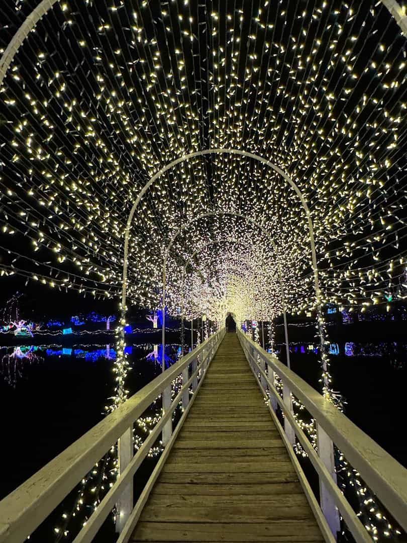 Illuminated light tunnel over a boardwalk at night at the Chickasha Festival of Light in Chickasha, Oklahoma