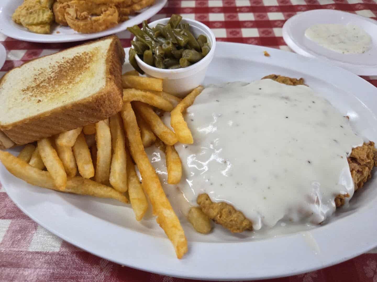 Chicken fried steak with cream gravy, french fries, and Texas toast at the Farm House in Mexia, Texas