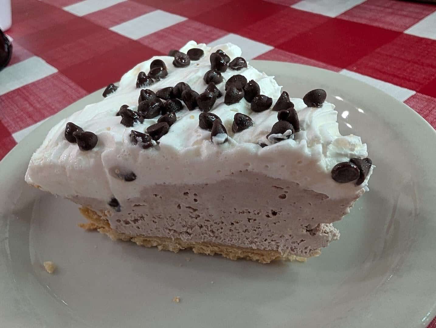 Tall slice of chocolate chip cream pie at Texan Cafe and Pie Shop in Hutto, Texas
