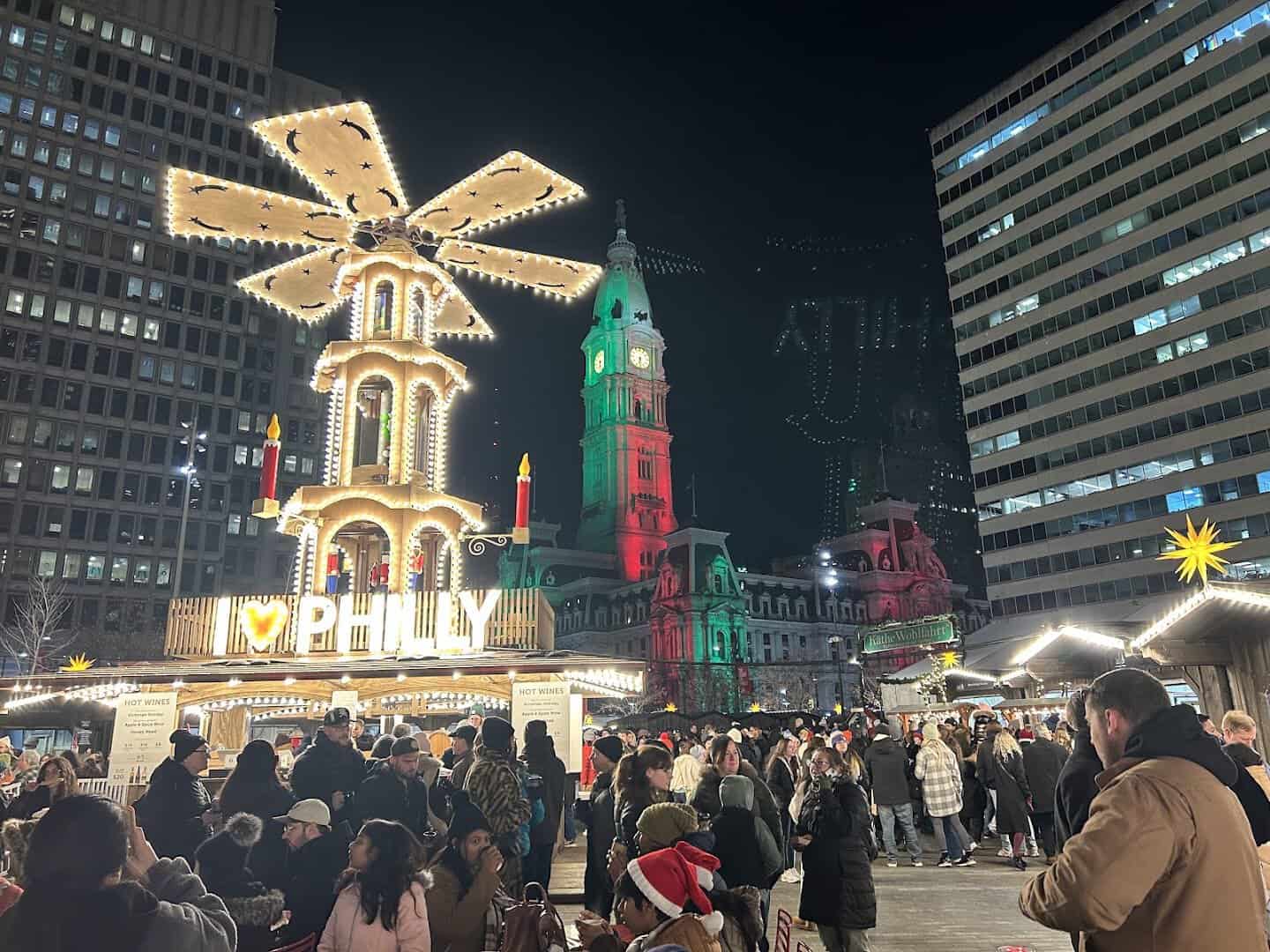 Lit German Christmas pyramid and market huts at Christmas Village in Philadelphia, Pennsylvania