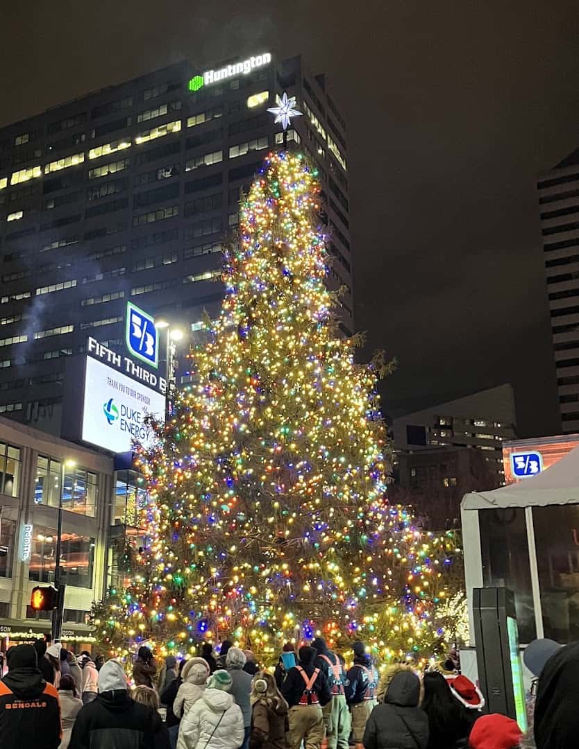 Lit Christmas tree and festive crowd at Fountain Square in Cincinnati, Ohio