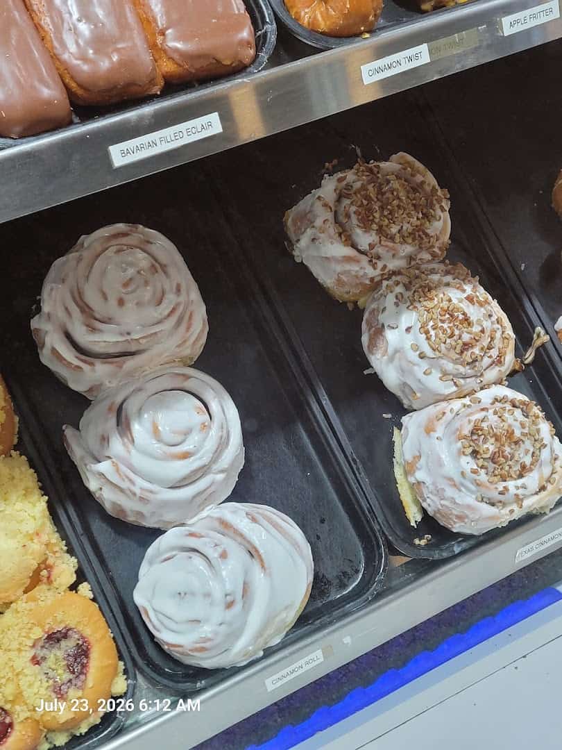 Fresh cinnamon rolls in the case at Round Rock Donuts in Round Rock, Texas