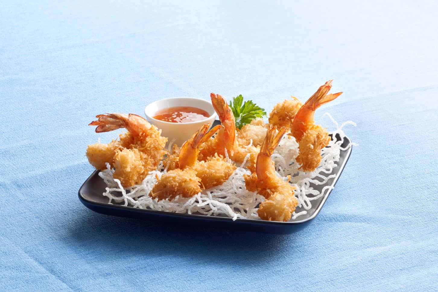 Coconut crunchy shrimp appetizer with dipping sauce at Chart House in San Antonio